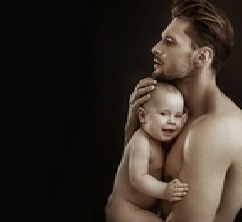 Blonde baby in mother's arms